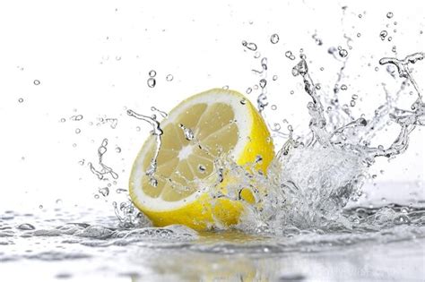 Premium Photo Slice Of Lemon With Water Drops Splash Isolated On White