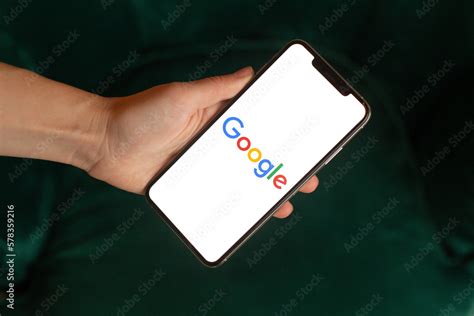 Mobile phone with the Google Logo on the screen Stock Photo | Adobe Stock