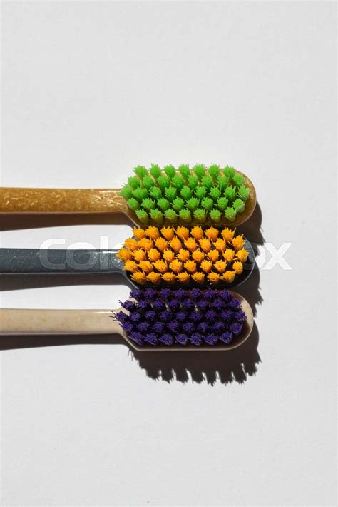 three different toothbrushes made from recycled plastic. eco product ...