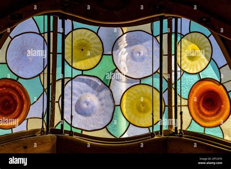 Original modernist stained glass windows designed by Antoni Gaudí on