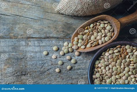 Green Lentils In Wooden Spoon Or Shovel On Wooden Background Stock