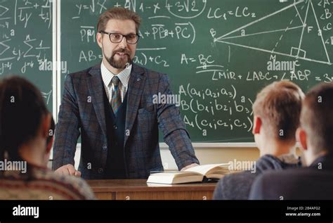 Math teacher with students Stock Photo - Alamy