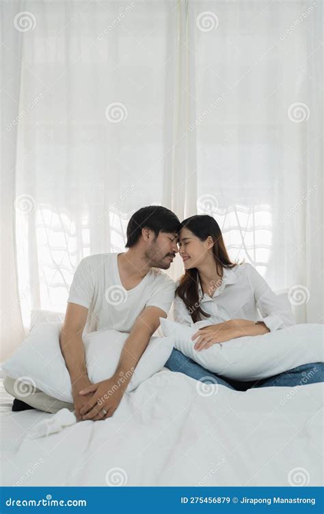 Asian Romantic Couple In Bed Enjoying Sensual Foreplay Happy Sensual