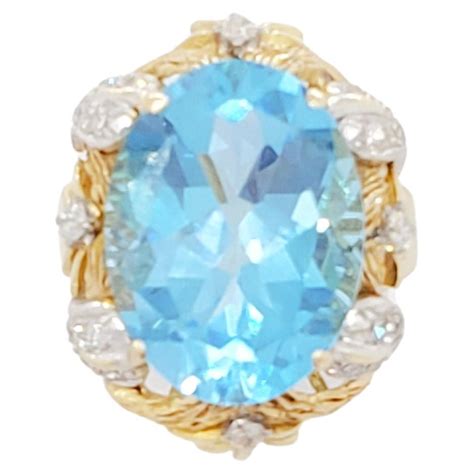 Oval Cut Blue Topaz In A Hand Diamond Ring In K Yellow Gold For Sale