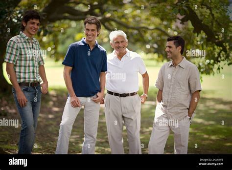 Front View Of Four Men Posing For The Camera Stock Photo Alamy