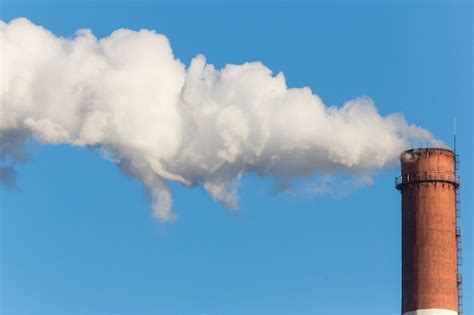 Premium Photo Smoke Emitting From Chimney Against Sky