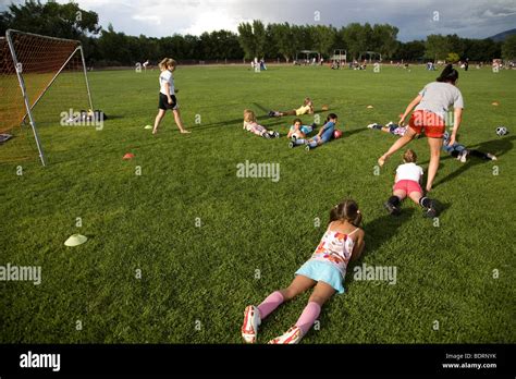 Girls getting training from soccer coach Stock Photo - Alamy