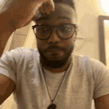 man holding head gifs tenor