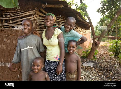 Smiling Children Stand Outside A House In Igamba Village Iganga