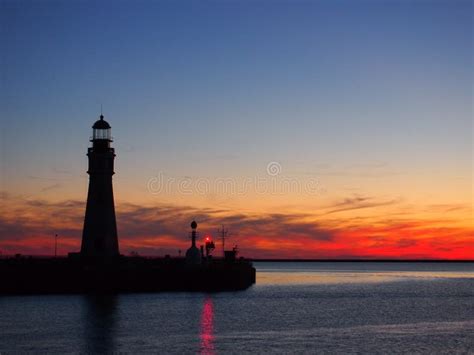 Lighthouse on sunset stock photo. Image of beauty, clouds - 27140592