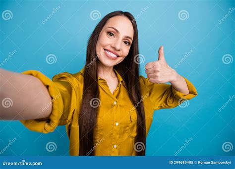 Photo Of Positive Toothy Woman Dressed Yellow Shirt Tacking Selfie