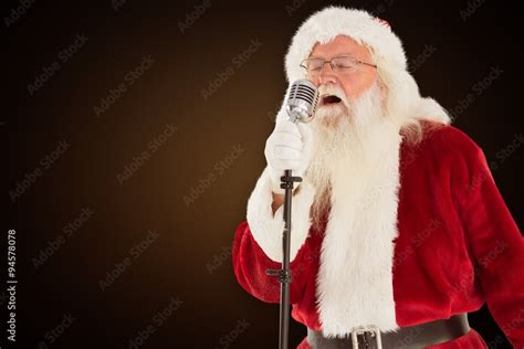 Composite image of santa claus is singing christmas songs Stock Photo | Adobe Stock