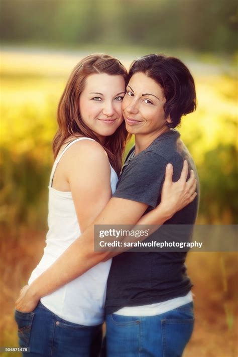 Attractive Lesbian Couple Hugging On Another Outside In Sunshine High