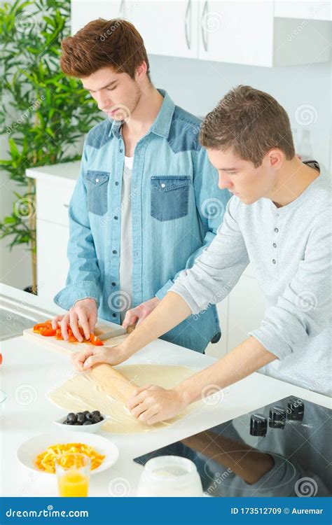 Two Young Men Rolling Out Dough Stock Image Image Of Bakery Playful