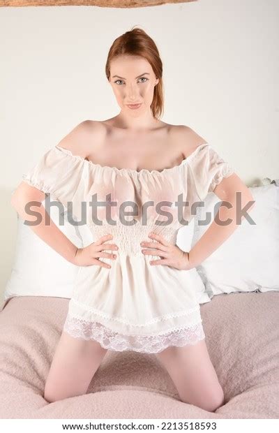 Attractive Redhead Model Lace Lingerie Applying Stock Photo