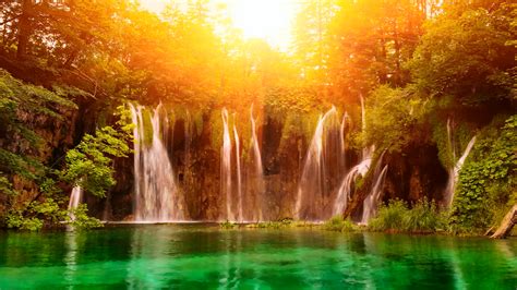 Serene Waterfall: A Vibrant HD Wallpaper of Nature's Beauty