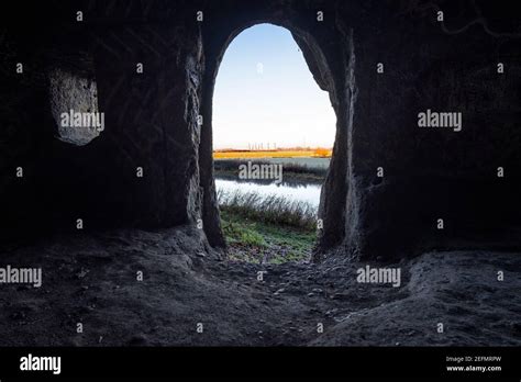 View Of Landscape From Inside A Cave Mouth Stock Photo Alamy