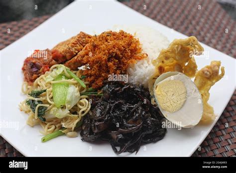 Delicious Stir Fried Squid With Black Ink Sauce Stock Photo Alamy