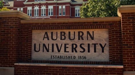 A General View Of An Auburn University Sign With Samford Hall In The