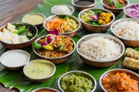 Traditional Onam Sadhya Feast Arranged On Banana Leaves With Vibrant