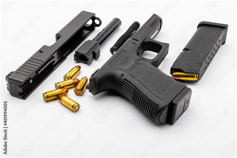 Parts of automatic pistol handgun with magazine on white isolated ...