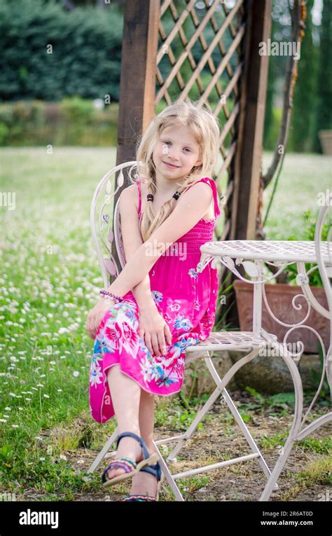 Little Child Posing Outdoors In Green Meadow Stock Photo Alamy