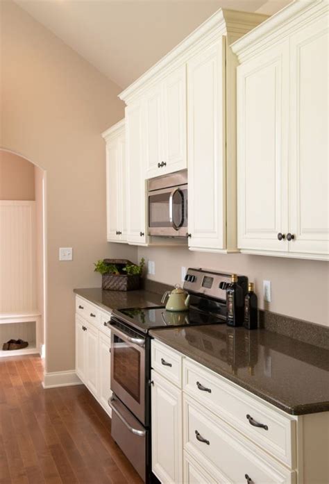 Kitchen With White Cabinets And Stainless Steel Appliances White