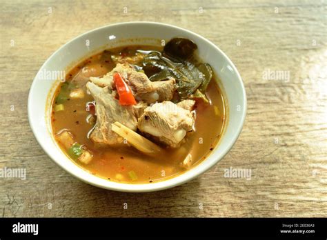 Hot And Spicy Pork Bone With Tamarind And Thai Herbs Soup On Bowl Stock Photo Alamy