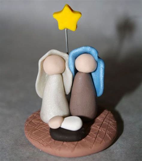 A Small Figurine With A Star On Top Of It And Another Figure Next To It