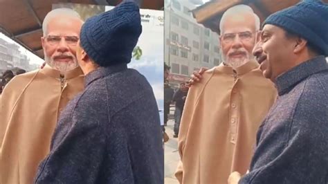 Pm Modi Viral Video Kashmiri Man Kisses Pm Modi Cutout And Hugs Him