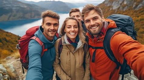 Premium Ai Image Four Hikers With Backpacks Take A Selfie While