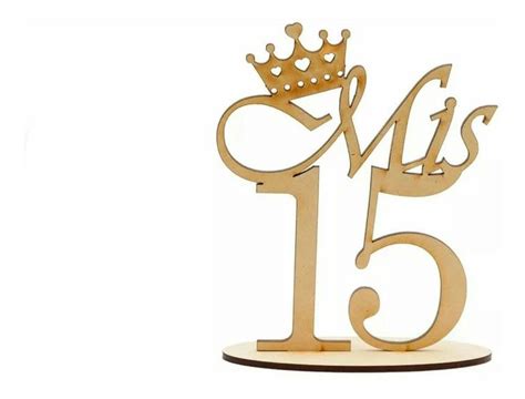 A Wooden Cake Topper With The Number Fifteen And A Crown On It S Head