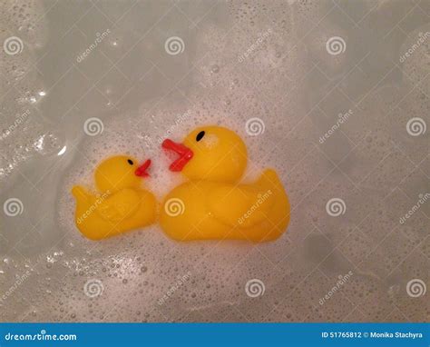 Rubber ducks in the bath stock photo. Image of water - 51765812