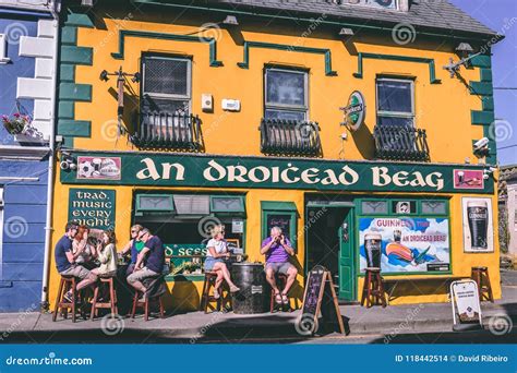 People Enjoying a Sunny Day in the Pubs in Dingle, Small Port Town on the Southwest of Ireland ...