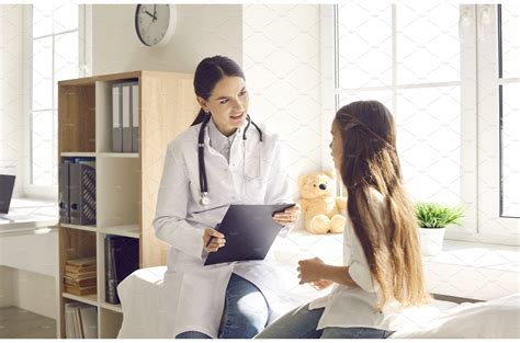 Child talking to a doctor at a | Health & Medical Stock Photos ...