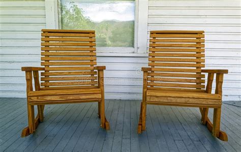 Two Wood Rocking Chairs Set On A White Wood Porch Stock Photo Image