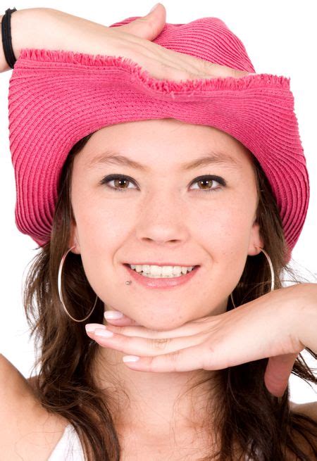 Beautiful Girl Wearing A Pink Hat Isolated Over A White Background