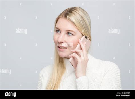 Blonde Woman Is Talking Listening On The Mobile Phone Stock Photo Alamy