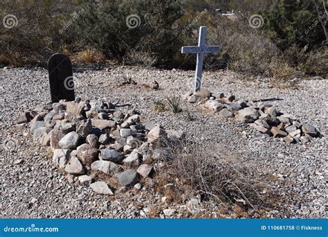 An Old Cemetery With Graves Covered With Rocks Know As Boothill Stock