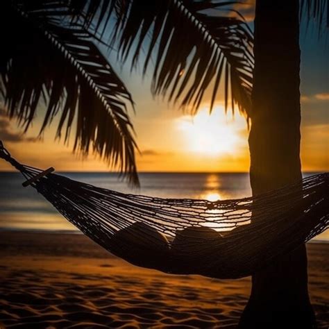 Premium AI Image | A person in a hammock on a beach at sunset