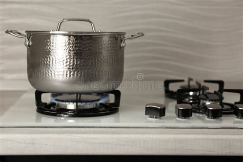 Shiny Steel Saucepan On Modern Gas Stove Stock Photo Image Of Chrome