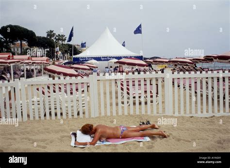 CANNES FILM FESTIVAL SUNBATHING ON THE BEACH DURING THE FILM FESTIVAL ...