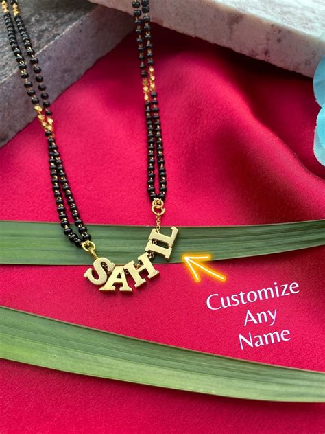 fancy  mangalsutra    black beads chain short mangalsut