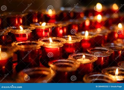 Several Rows Of Burning Votive Candles In A Dark European Catholic Church In Rome Italy Seeking