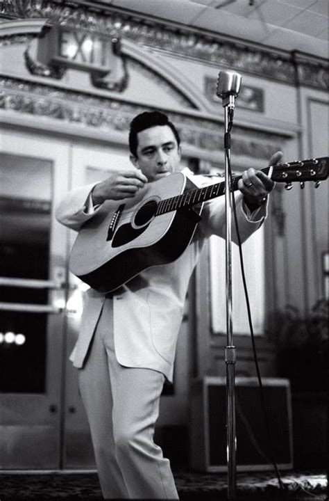 Johnny Cash And His Most Popular Way Of Playing His Guitar The Blonde In The Pic Johnny Cash