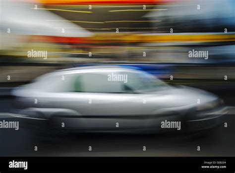 Car happens at breakneck speed a gas station Stock Photo - Alamy