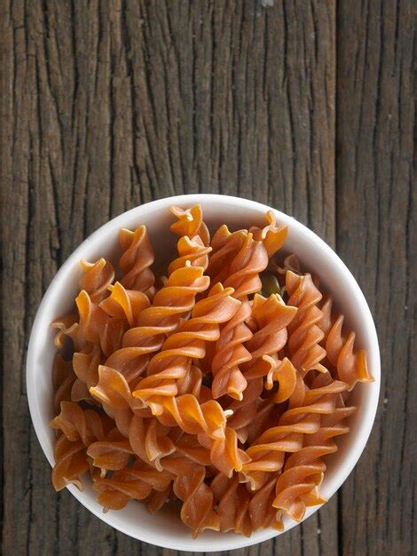 Premium Photo Close Up Of Fusilli Pasta On Table