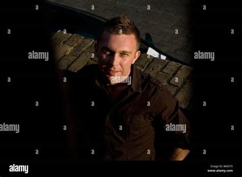 A Portrait Of A Good Looking Homosexual Or Gay Man Leaning Up Against