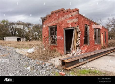 Abandoned Red Brick Building With Steel Girders On Overcast Day Stock