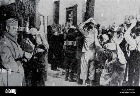 Photograph showing a Gestapo raid on the Warsaw Ghetto. The Gestapo ...